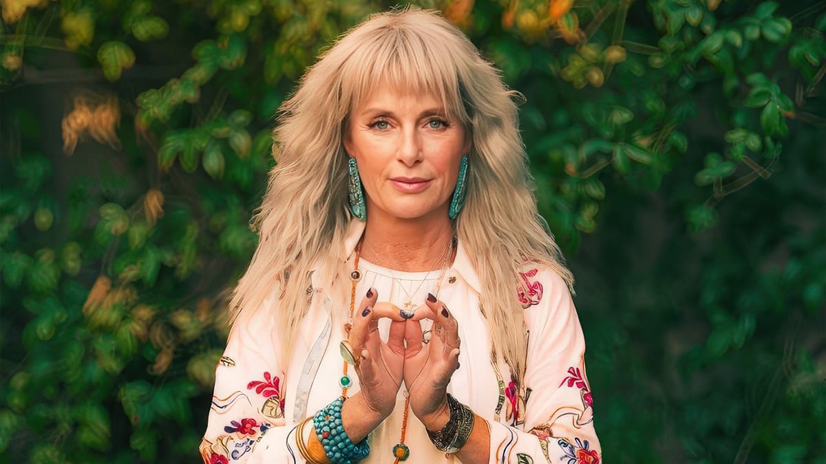 Melanie MataJi, founder of The MataJi Sanctuary, hands in mudra, Las Vegas wellness studio.